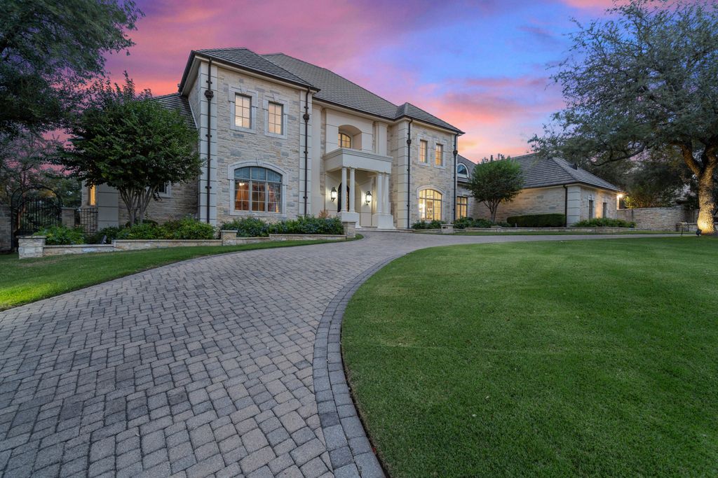 208 Bella Riva Drive, Austin, Texas seated on a well-manicured acre lot with complete privacy and lake views in the coveted gated community of Costa Bella on Lake Travis boasting timeless, high-quality craftsmanship abounds in every corner.