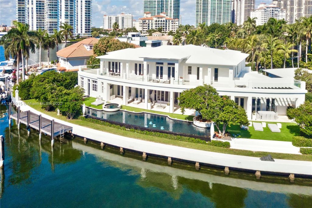 142 South Island, North Miami Beach, Florida is an impeccable residence with 188 feet of prime water frontage and amazing features including panoramic private views, fabulous resort-like amenities and beautiful landscape. 