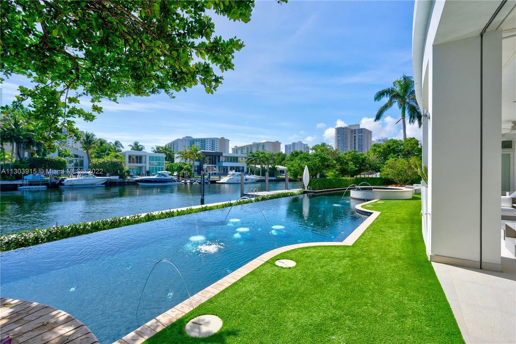 142 South Island, North Miami Beach, Florida is an impeccable residence with 188 feet of prime water frontage and amazing features including panoramic private views, fabulous resort-like amenities and beautiful landscape. 