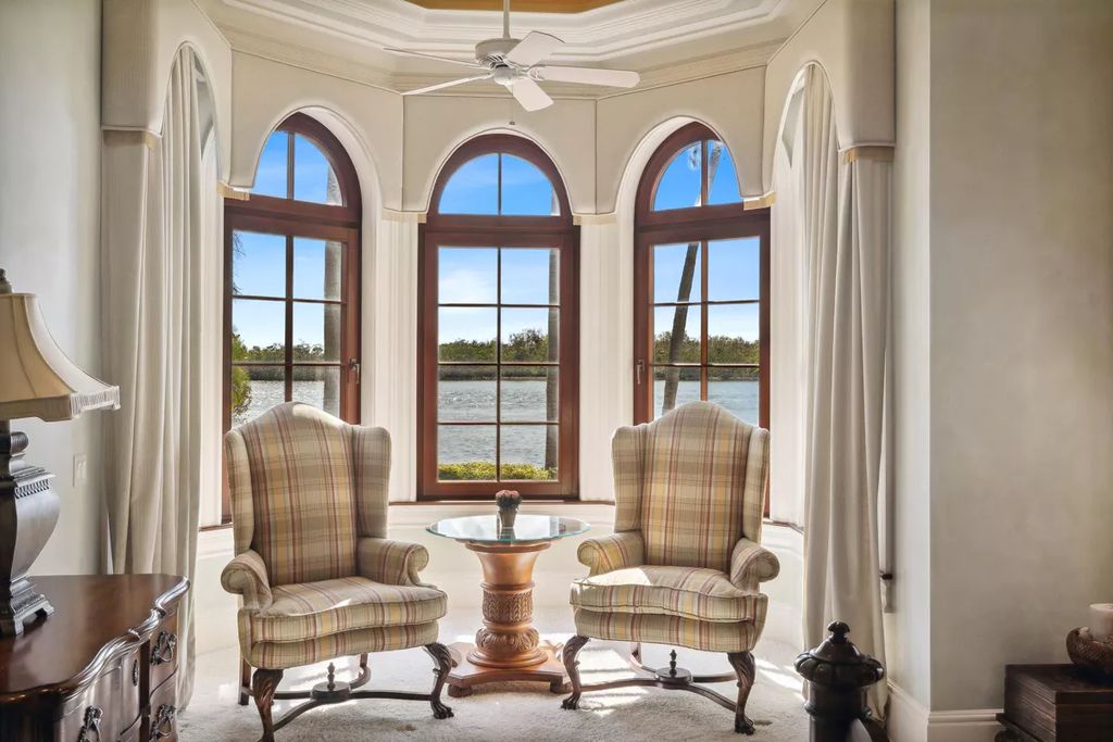950 Admiralty Parade East, Naples, Florida is a custom estate on one and a half lots in the coveted Port Royal neighborhood encompassing a handsome downstairs study, 3 car garage plus the ability for lifts, separate guest casita over the garage and private elevator.