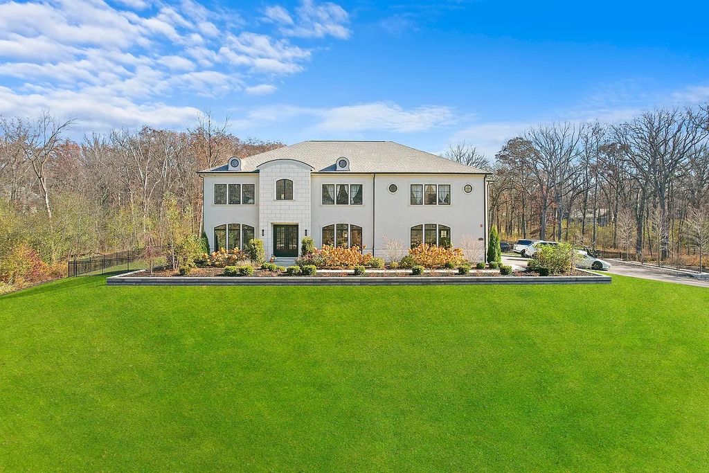 The Estate in Lincolnshire offers a grand scale foyer, ebony oak floors, an open floor plan, soaring ceiling heights, custom luxury finishes throughout now available for sale. This home located at 23477 N Elm Rd, Lincolnshire, Illinois