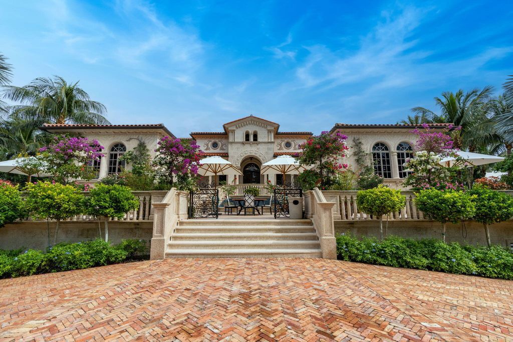 1110 S Ocean Boulevard, Manalapan, Florida is a one-of a kind estate with 150 feet of ocean and Intracoastal frontage perfect for entertaining with features in rich details, intricate millwork, and sophisticated finishes.