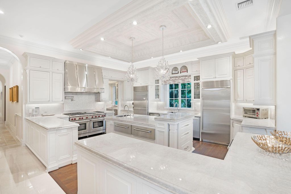 1110 S Ocean Boulevard, Manalapan, Florida is a one-of a kind estate with 150 feet of ocean and Intracoastal frontage perfect for entertaining with features in rich details, intricate millwork, and sophisticated finishes.