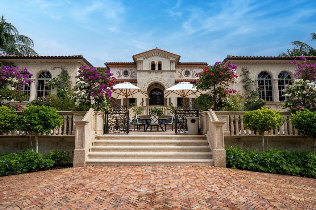 1110 S Ocean Boulevard, Manalapan, Florida is a one-of a kind estate with 150 feet of ocean and Intracoastal frontage perfect for entertaining with features in rich details, intricate millwork, and sophisticated finishes.