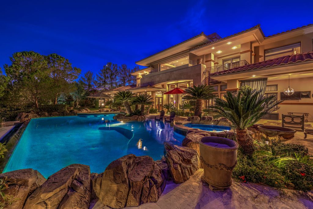 The Villa in Las Vegas, a magnificent estate with stunning oversized infinity edge resort pool, huge hot tub, 2 covered resort style patios, a large hardscape for entertaining, the strip views, city views and mountain views is now available for sale. This home located at 10 Wild Ridge Ct, Las Vegas, Nevada