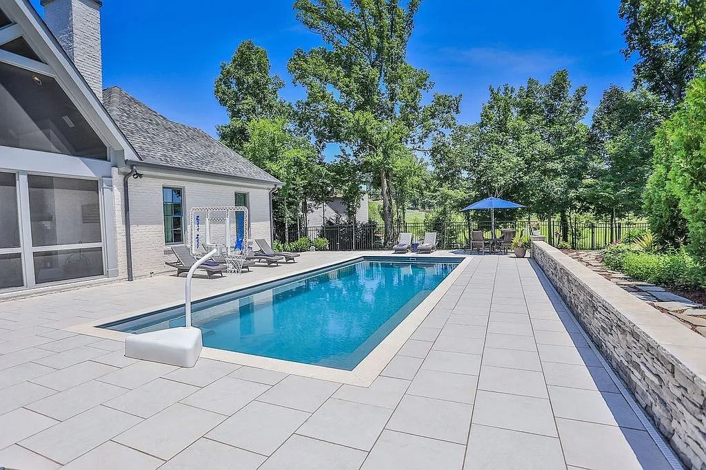 The Estate in College Grove is a luxurious home offering a gorgeous backyard with a heated saltwater pool and an open floor plan now available for sale. This home located at 7301 Harlow Dr, College Grove, Tennessee; offering 05 bedrooms and 06 bathrooms with 5,045 square feet of living spaces.