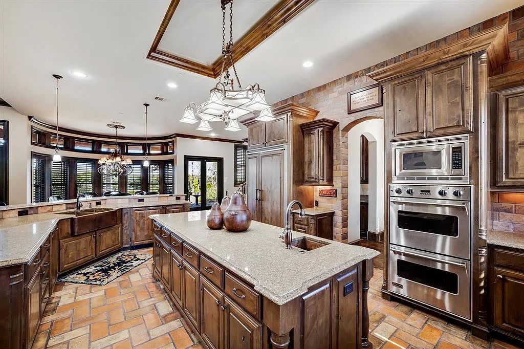 1101 E Hickory Hill Road, Argyle, Texas is a meticulous estate with amazing amenities including 4 fireplaces, climate-controlled wine room accommodates 250-300 bottles, exercise room, guest suite, game room, poker room, media room.