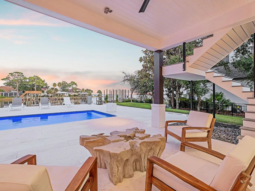 458 Shipwreck Rodd E, Santa Rosa Beach, Florida is a stunning new bayfront home boasts generous indoor and outdoor areas for entertaining, including 2,300 square feet of shell stone on the rear patio.