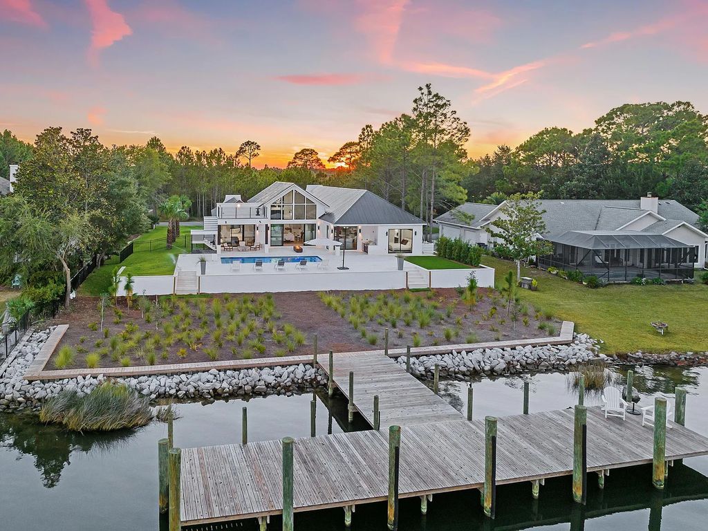 458 Shipwreck Rodd E, Santa Rosa Beach, Florida is a stunning new bayfront home boasts generous indoor and outdoor areas for entertaining, including 2,300 square feet of shell stone on the rear patio.