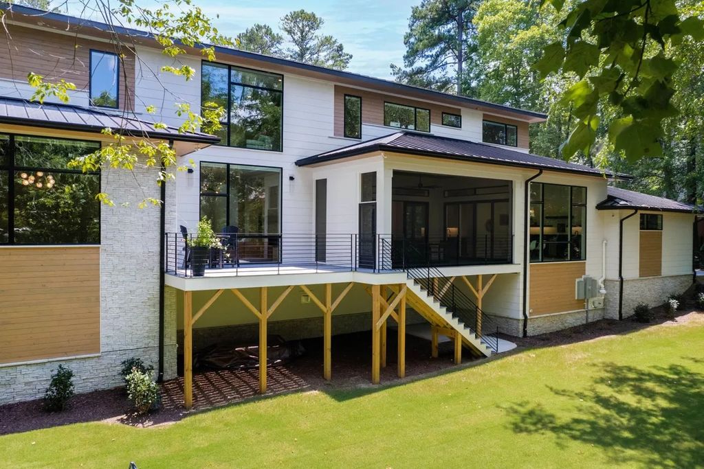 The Estate in Raleigh is a luxurious home featuring open-concept with natural light and expansive windows throughout now available for sale. This home located at 7145 N Ridge Dr, Raleigh, North Carolina; offering 04 bedrooms and 05 bathrooms with 5,702 square feet of living spaces. 