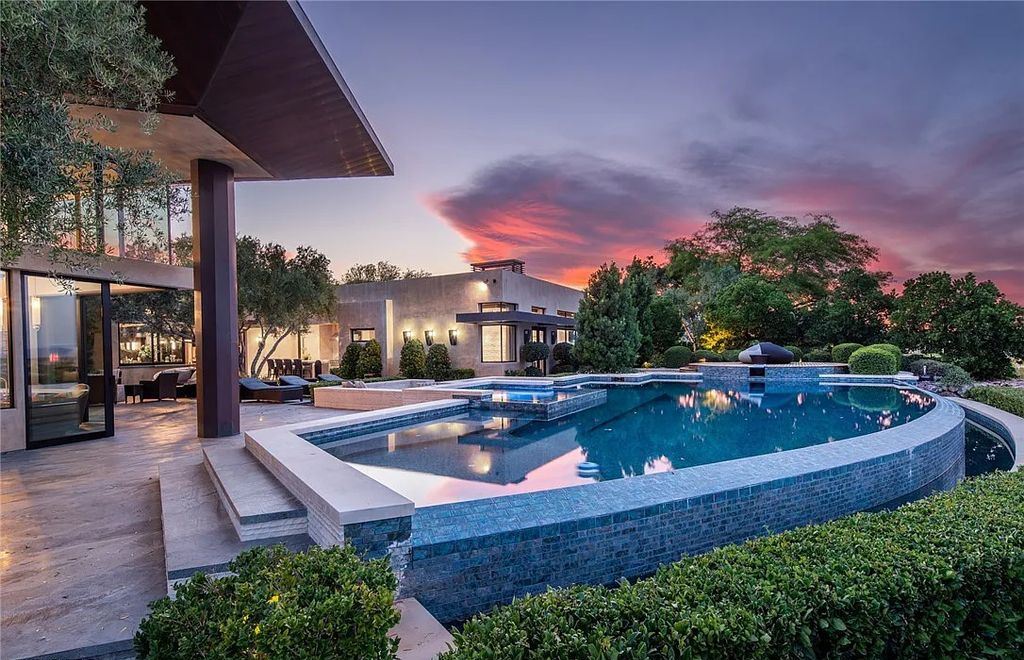 5 Promontory Ridge Drive, Las Vegas, Nevada is a desert contemporary masterpiece set on a cul-de-sac Ridge lot with unobstructed strip, city, mountain and golf course views comes with unparalleled quality of construction. 
