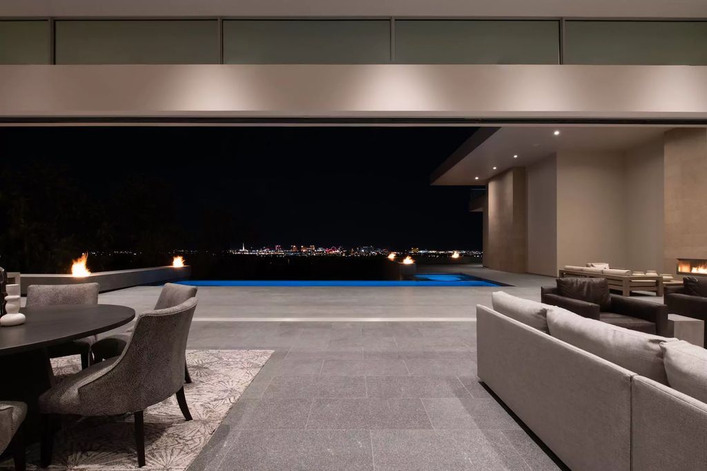 10861 Stardust Drive, Las Vegas, Nevada is spectacular property located in Discovery Land Company’s coveted and exclusive Summit Club offering the ultimate in privacy sitting on its own 1.37-acre peninsula lot.