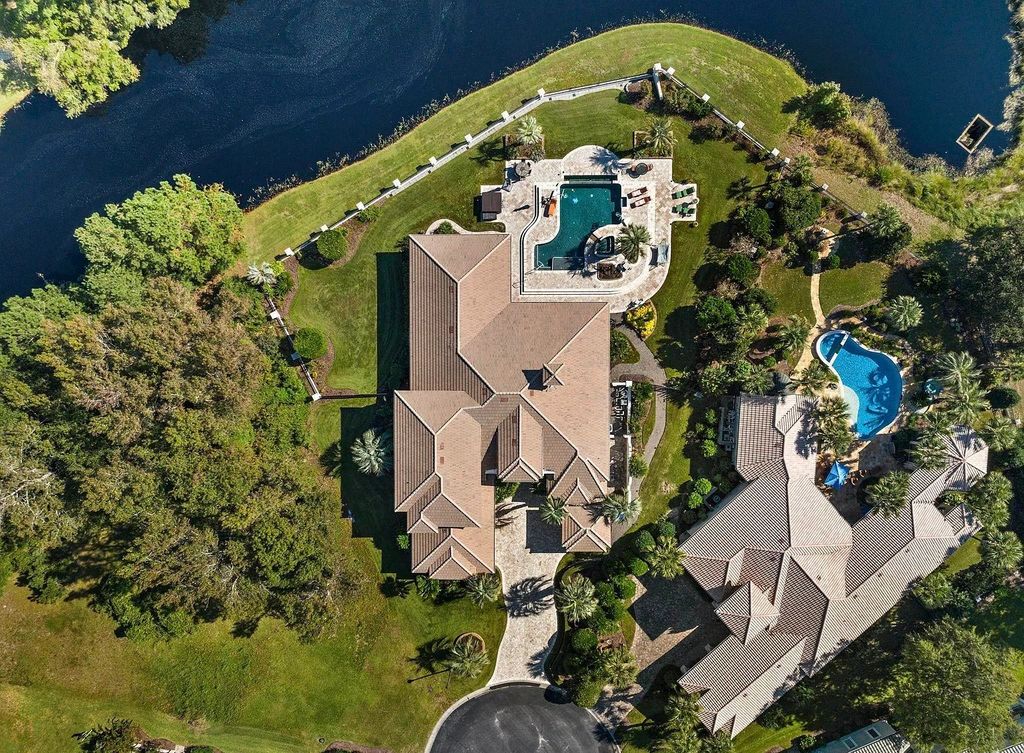 The House in Myrtle Beach is situated on 0.57 acres of land, which includes more than 200 feet of golf course and lakefront views, now available for sale. This home located at 1495 Scala Ct, Myrtle Beach, South Carolina