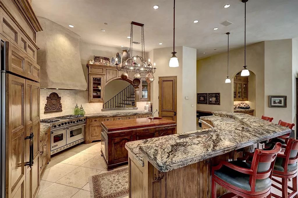 11111 Claymore Road, Houston, Texas is an extraordinary home on an amazing 0.95 acre lot with impressive amenities including temperature controlled wine room for 2200+ bottles, well-equipped kitchen, and more.