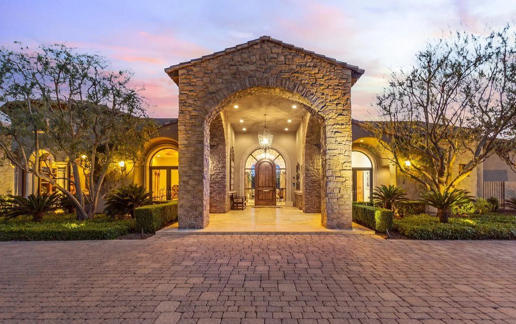 6601 E Malcomb Drive, Paradise Valley, Arizona is a privately gated estate situated on resort-like grounds featuring a domed executive office, large entertainment room, study area, theater, wet bar, butler's pantry, and 3 gas fireplaces.