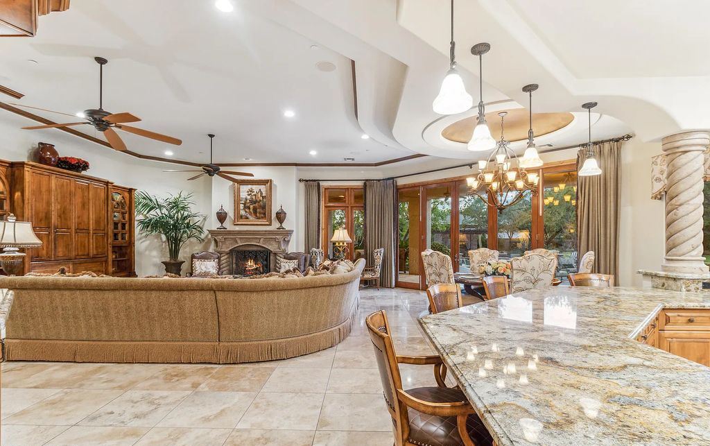 6601 E Malcomb Drive, Paradise Valley, Arizona is a privately gated estate situated on resort-like grounds featuring a domed executive office, large entertainment room, study area, theater, wet bar, butler's pantry, and 3 gas fireplaces.