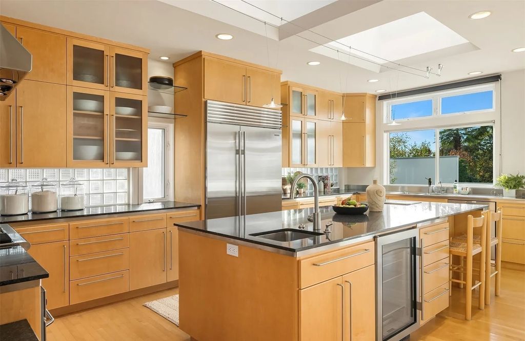 The House in Yarrow Point offers sleek sophistication, spacious kitchen, multiple sets of French doors open to fabulous outdoor spaces, now available for sale. This home located at 4000 92nd Avenue NE, Yarrow Point, Washington