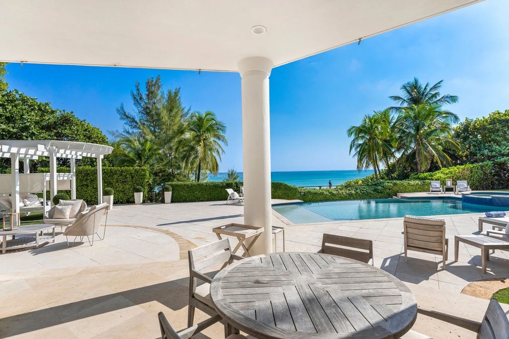 317 Ocean Boulevard, Golden Beach, Florida is an exceptional ocean front estate with luxurious amenities including formal dining room with maple paneling, movie theater, elevator, help quarters, finished basement, gym, and 2 large storage rooms. 