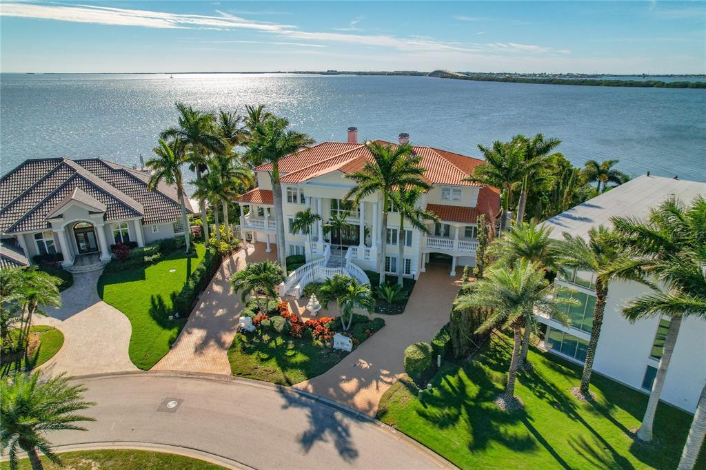 6199 54th St S, Saint Petersburg, Florida is a waterfront estate was designed to enjoy entertaining and outdoor living with expansive waterfront decks to experience a seamless indoor outdoor living with waterfall surrounded by mature privacy landscape.