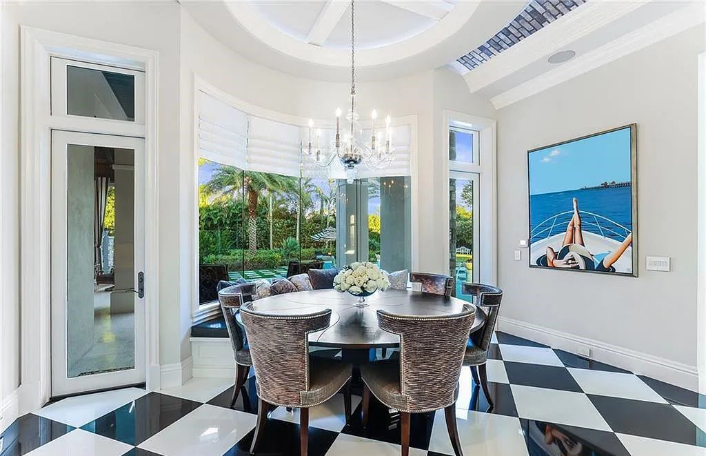482 Ridge Drive, Naples, Florida, is located in a desirable Naples neighborhood, just minutes from Vanderbilt Beach, Mercato, and Waterside shops. This stunning home was built with meticulous attention to detail, including a butterfly staircase and marble floors.
