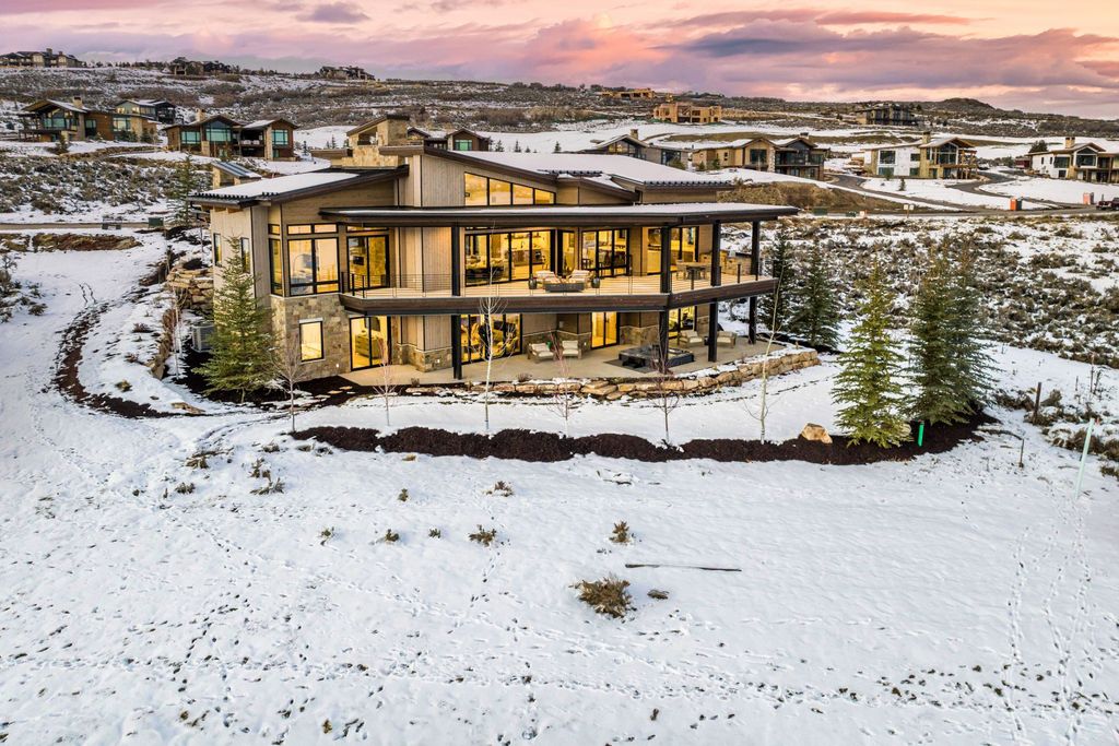 3914 E Firestar Court, Kamas, Utah is a stunning custom build located within the ''Whispering Hawk'' neighborhood of the private, gated Talisker Club community, Tuhaye, and backing onto the emerald green 15th fairway of the award-winning Mark O'Meara designed championship golf course.