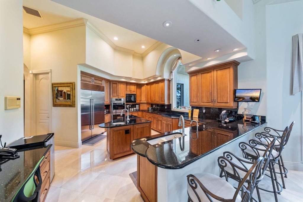 4188 Brynwood Drive, Naples, Florida, has a well-designed floor plan with long water and golf views. Because of the ample entertainment space inside and out, as well as the new roof for the interior and exterior, this home will be able to accommodate anyone's wish list in 2020.