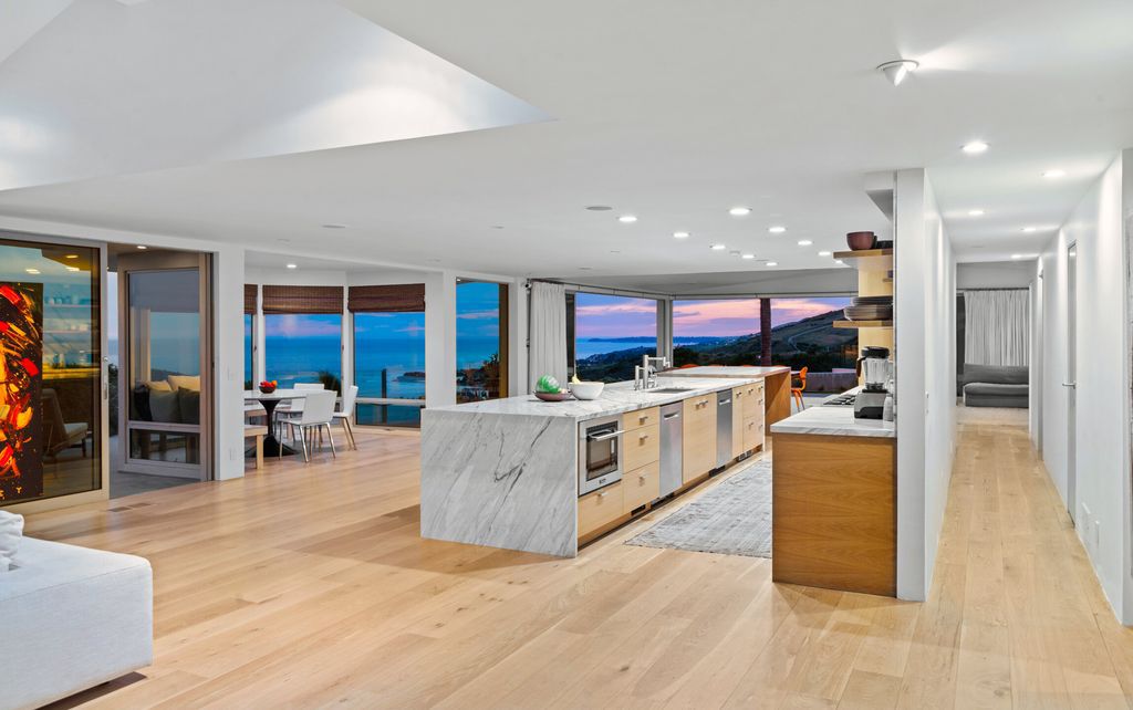 22407 Carbon Mesa Road, Malibu, California is truly a golfer's retreat in a spectacular, verdant setting on a gated promontory of more than two manicured acres on two parcels, views that take in a panorama of ocean, islands, and coastline from Point Dume and the Malibu Pier to Palos Verdes.