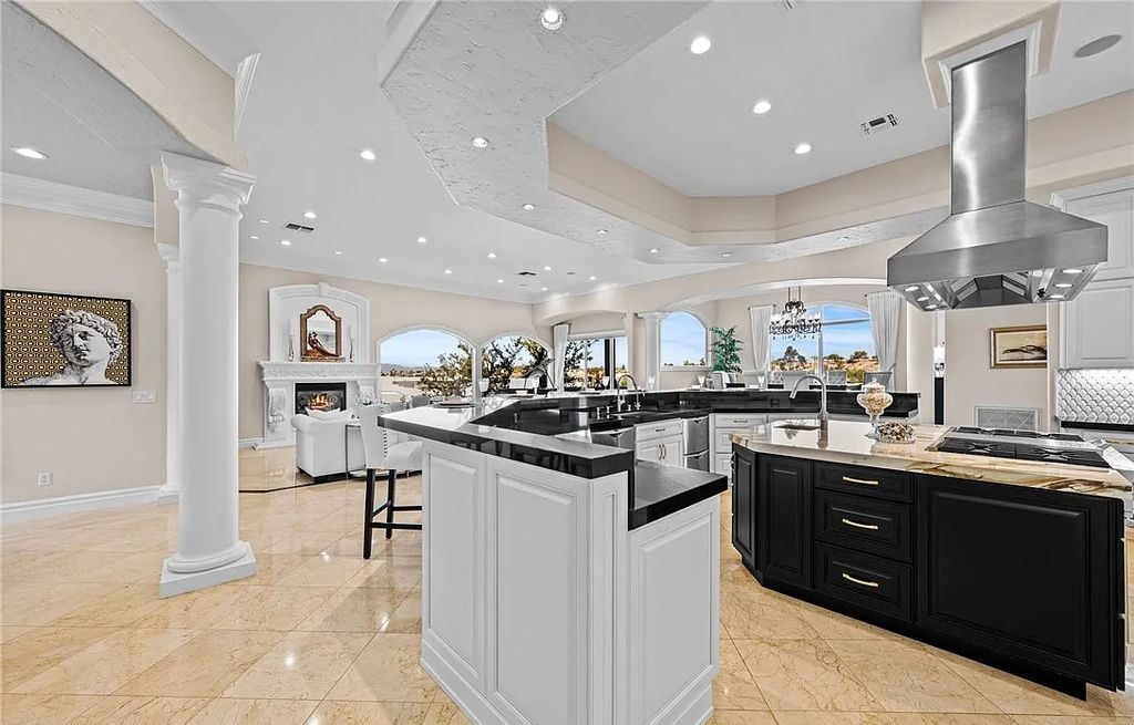 2876 Quartz Canyon Drive, Henderson, Nevada is custom-built residence has been updated with the finest finishes boasting gorgeous views of the Las Vegas Strip, the golf course, the lake, and mountains in every direction.