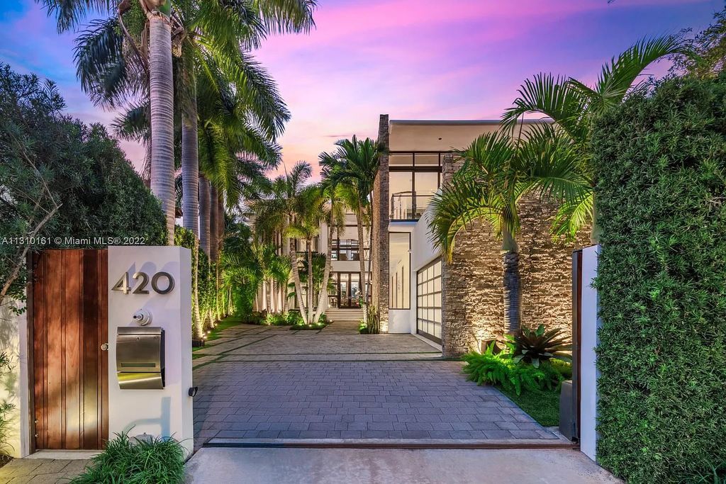 420 W Rivo Alto Drive, Miami Beach, Florida, is a tropical modern residence with seamless indoor-outdoor living and luxurious finishes on Venetian Island. When entering the house, there is a direct flow through a covered deck and panoramic water views.