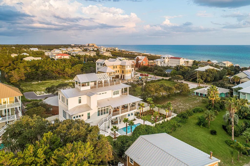 178 Pompano Street, Inlet Beach, Florida is an extraordinary Nantucket inspired home located only 200 yards away from the sandy white beaches of Inlet Beach with vaulted pecky cypress ceilings, leather porcelain floors, and the highest grade finishes.