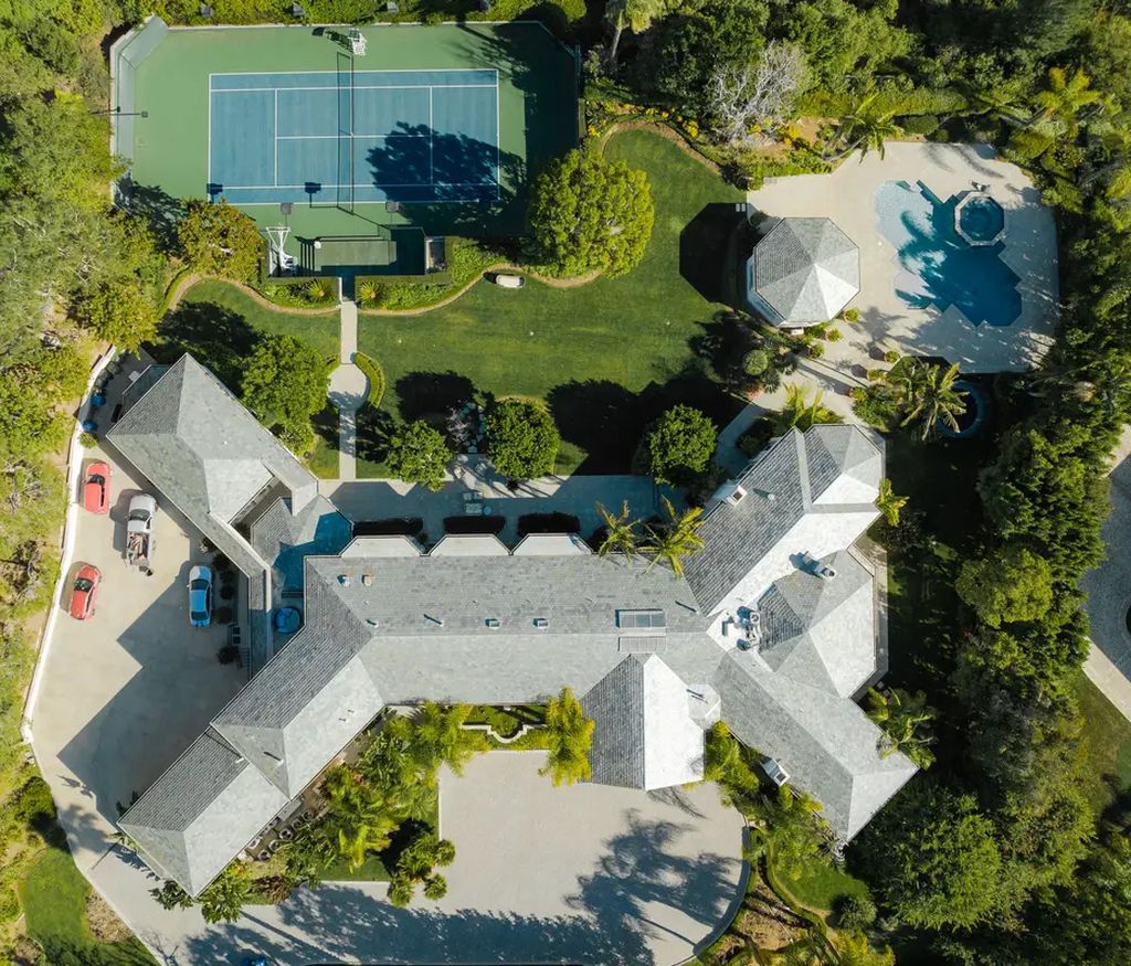 24 Beverly Park Terrace, Beverly Hills, California is a palatial estate stands on over 2.2 acres of sprawling grounds in the esteemed enclave of North Beverly Park boasting impressive spaces for entertaining and lavish amenities inside and out. 