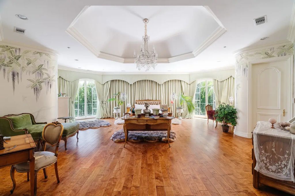 24 Beverly Park Terrace, Beverly Hills, California is a palatial estate stands on over 2.2 acres of sprawling grounds in the esteemed enclave of North Beverly Park boasting impressive spaces for entertaining and lavish amenities inside and out. 