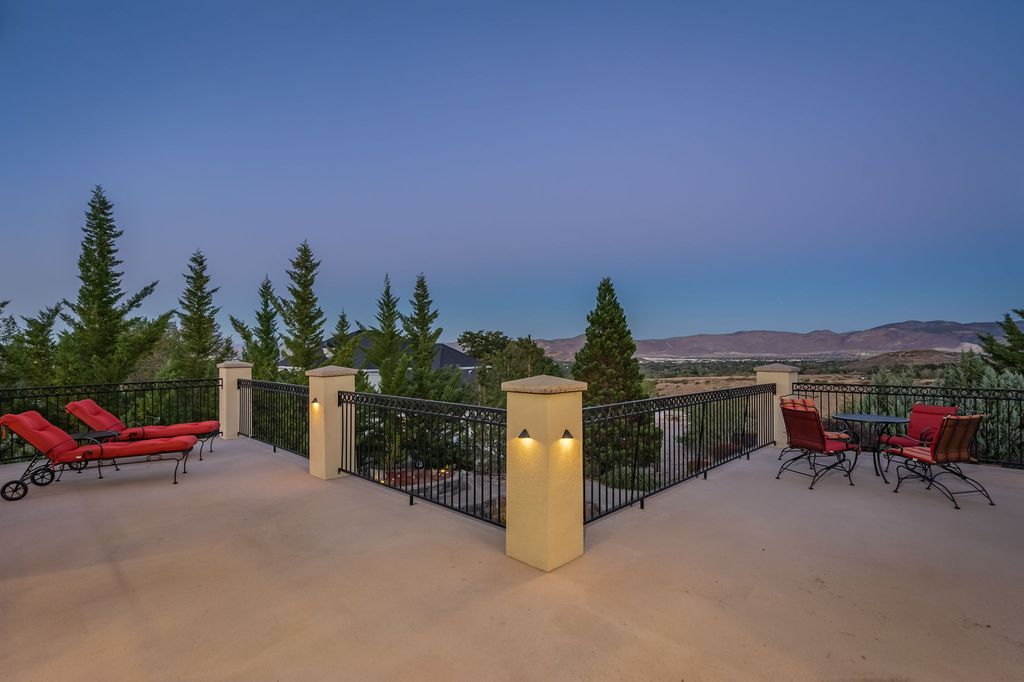 220 Brunswick Mill Road, Reno, Nevada is a thoughtfully designed custom estate on a 2.5 acre fully-fenced lot with gated entrance and a variety of landscape accents such as a relaxing water feature, wind-protected firepit with surround seating, private putting green, basketball court.