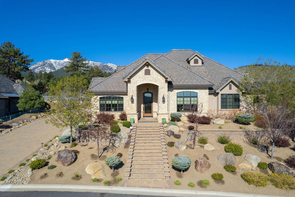 16955 Salut Court, Reno, Nevada is a custom home built by Neil Adams located inside the gates of the Montreux Golf and Country Club with a private Tuscany style courtyard and a rare combination of fine craftsmanship, relaxed comfort and luxury living.