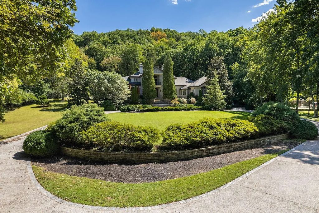 The Home in Nashville provides extensive landscaping throughout the property with dogwoods, hydrangeas and a meandering creek, now available for sale. This home located at 1310 Chickering Rd, Nashville, Tennessee