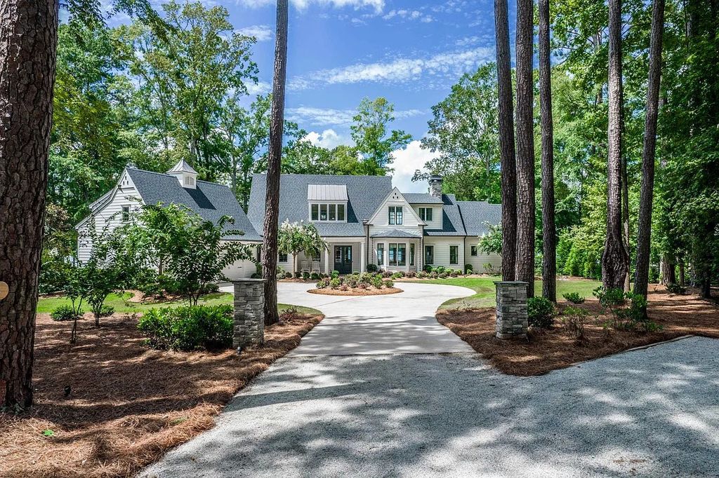 The House in Eatonton boasts gorgeous landscaping and 180 degree views of Lake Oconee, now available for sale. This home located at 158 Bradford Dr, Eatonton, Georgia
