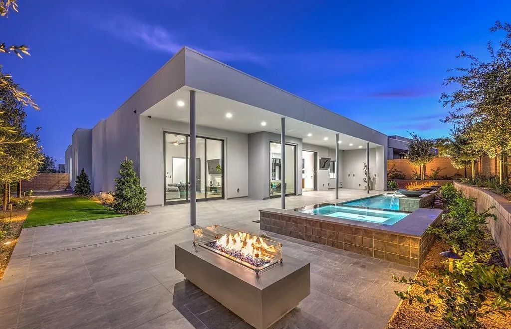 33 Hawkeye Lane, Summerlin, Nevada is an exquisite newly built custom home in Talon Ridge at The Ridges with private indoor outdoor living at its finest featuring including an expansive hideaway sliding glass door leading to custom pool and spa & large covered patio area.