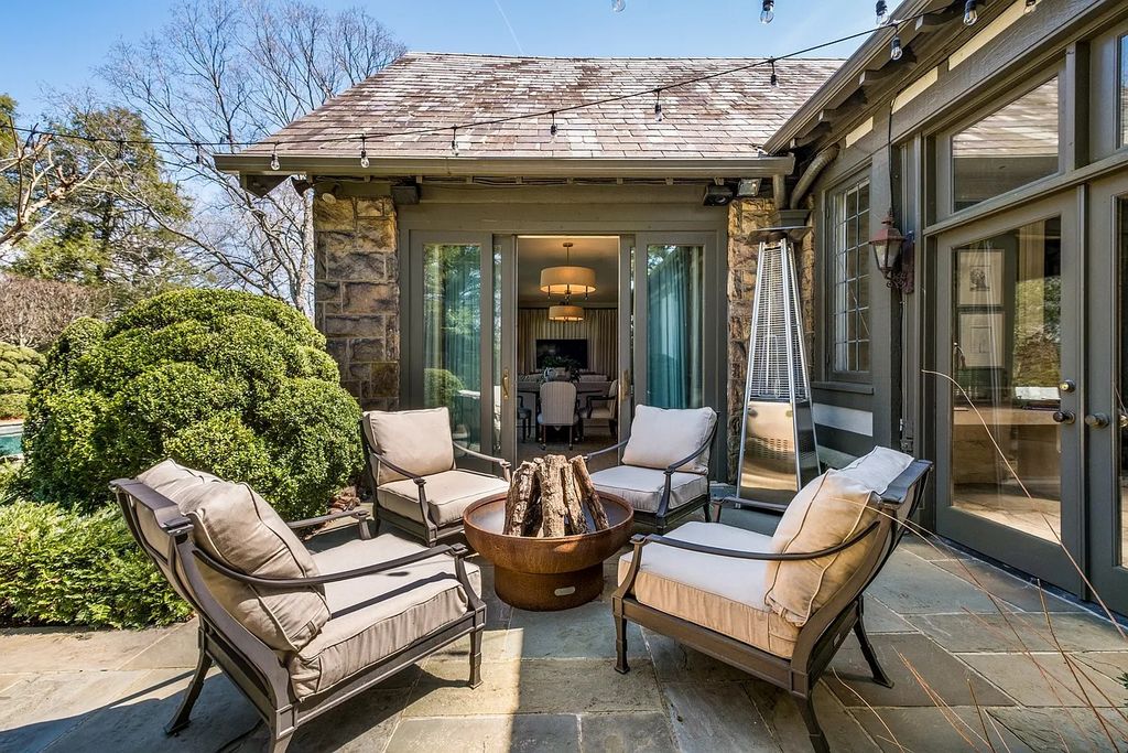 The Residence in Nashville offers sprawling main level, but terraces, pool, tennis and mature gardens designed by Ben Page, now available for sale. This home located at 3800 Woodlawn Dr, Nashville, Tennessee