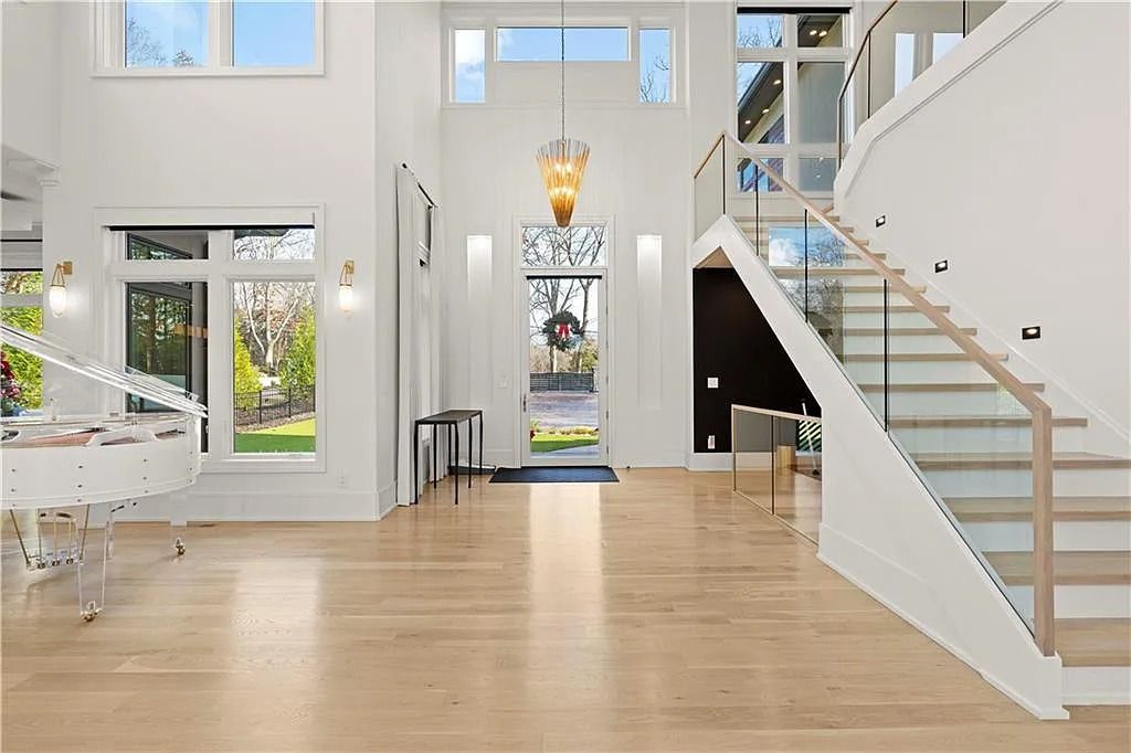 The Estate in Atlanta is a luxurious home with an open concept floor plan featuring gorgeous white oak hardwood flooring throughout, now available for sale. This home located at 1107 Moores Mill Rd NW, Atlanta, Georgia