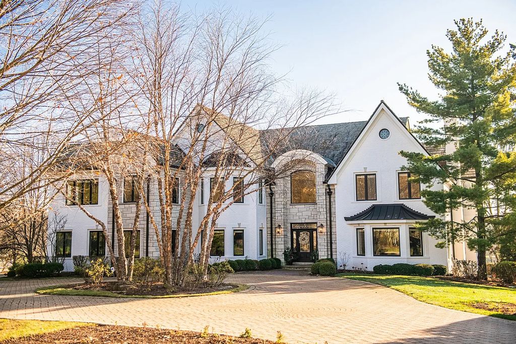 The Home in North Barrington has an elegant white brick exterior, dramatic circular driveway, heated four-car garage loaded with storage space, now available for sale. This home located at 23 Hallbraith Ct, North Barrington, Illinois