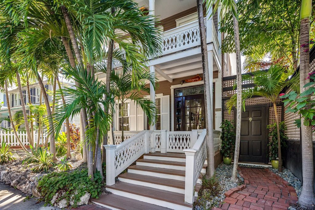 322 Elizabeth Street, Key West, Florida, was built around 1890 by ship captain Benjamin Saunders and has recently been beautifully restored. This classic revival home is located in the heart of Old Town, two blocks from downtown Duval Street and close to the historic seaport, restaurants, and attractions.