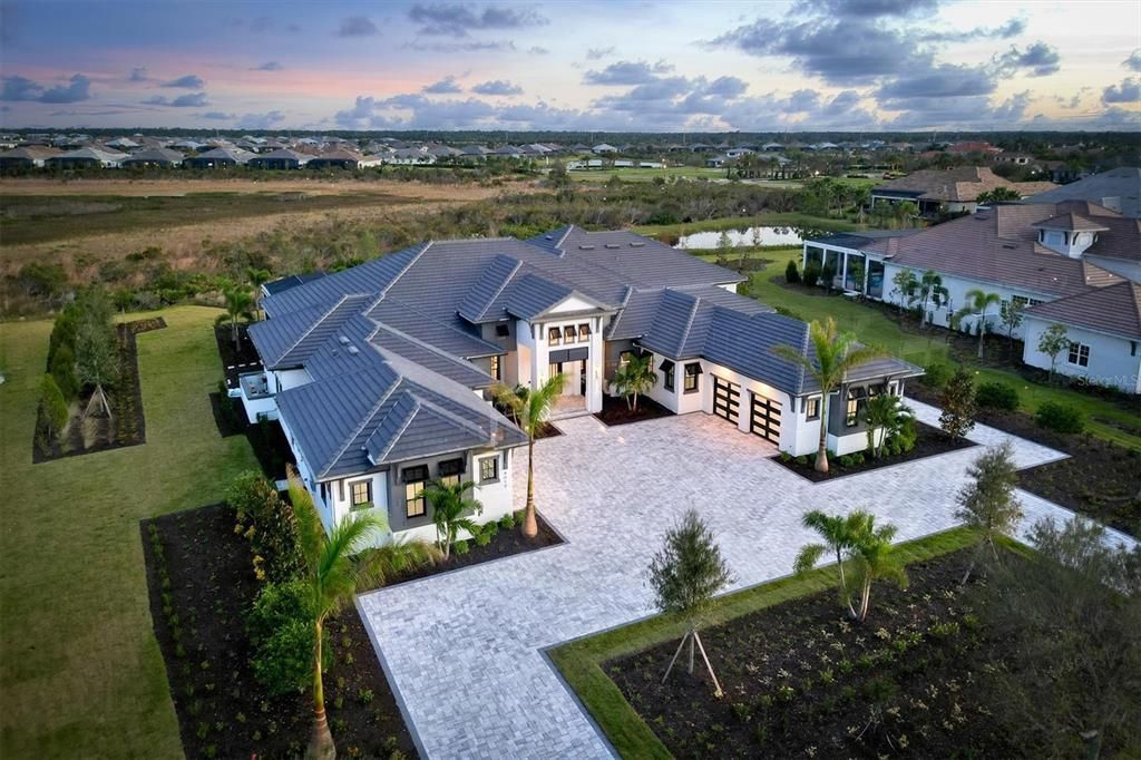 8019 Bowspirit Way, Lakewood Ranch, Florida, is a finally modern luxury and opulence in the Lake Club at Lakewood Ranch, situated on 1.13 acres. No other home built to such crafted and magnificent residence has every detail hand selected by the accomplished designers.