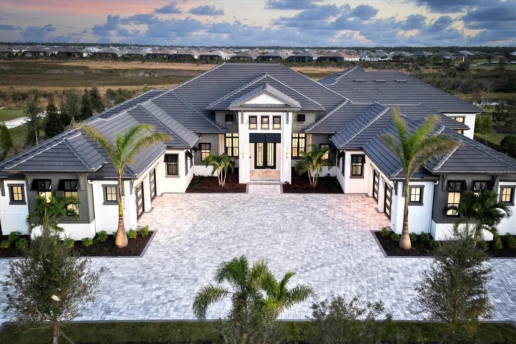 8019 Bowspirit Way, Lakewood Ranch, Florida, is a finally modern luxury and opulence in the Lake Club at Lakewood Ranch, situated on 1.13 acres. No other home built to such crafted and magnificent residence has every detail hand selected by the accomplished designers.