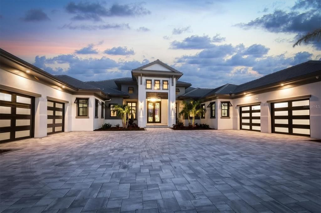 8019 Bowspirit Way, Lakewood Ranch, Florida, is a finally modern luxury and opulence in the Lake Club at Lakewood Ranch, situated on 1.13 acres. No other home built to such crafted and magnificent residence has every detail hand selected by the accomplished designers.