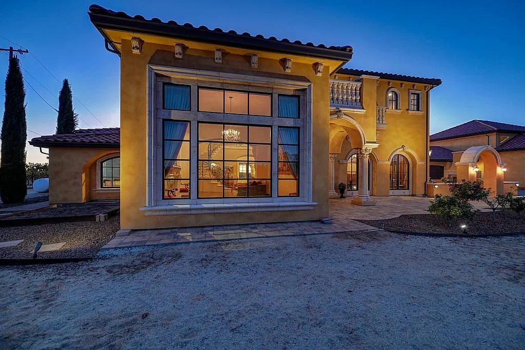 100 Shultz Vineyard Road, Shingle Springs, California is an architectural masterpiece overlooks a gorgeous working vineyard including state of the art appliances, high-end fixtures and finishes, custom iron works, and hand carved marble fireplaces and soaking tub.