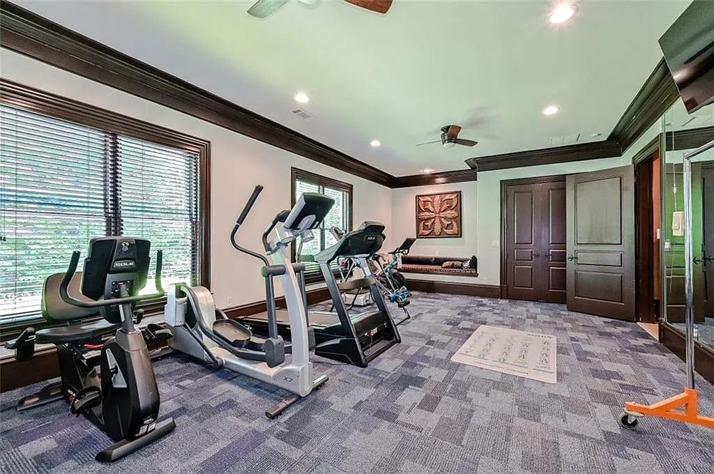 The Estate in Sandy Springs features an open recreation area, game room, gym, theater, steam room, a wine cellar, and more, now available for sale. This home located at 831 Mount Paran Rd, Sandy Springs,  Georgia