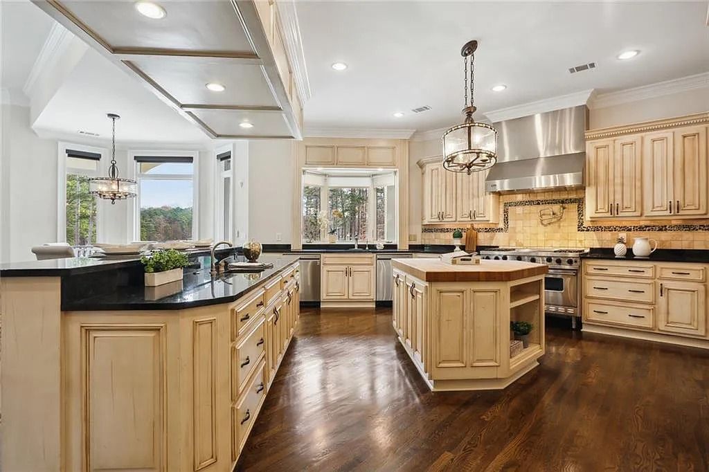 The Estate in Buford is a luxurious home offering the ultimate in privacy now available for sale. This home located at 6617 Garrett Rd, Buford, Georgia; offering 06 bedrooms and 07 bathrooms with 10,200 square feet of living spaces.