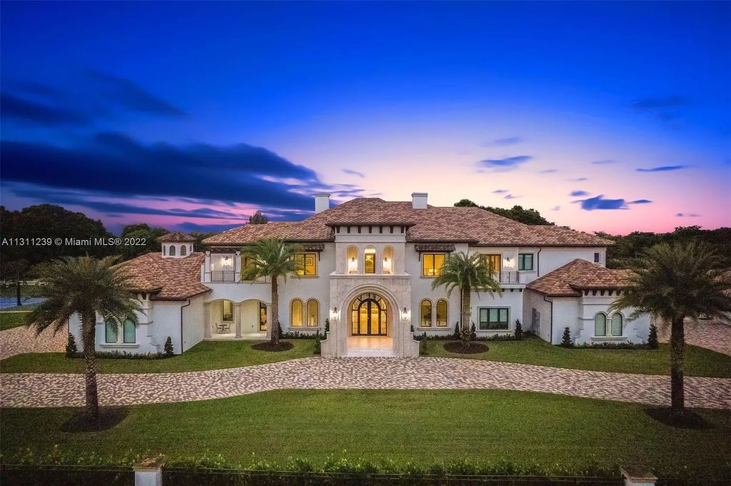 5875 Stone Creek Way, Fort Lauderdale, Florida, built by acclaimed builder Rick Bell, sits on 5 acres and boasts over 20,000 square feet of space. This incredible and one-of-a-kind custom compound's grand estate, including private gates, features volume ceilings, a resort-style pool, and top-of-the-line appliances.