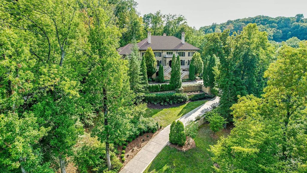 The Estate in Franklin is a luxurious home featuring private gated entry, mature trees, established landscaping, and beautiful views now available for sale. This home located at 1037 Vaughn Crest Dr, Franklin, Tennessee; offering 08 bedrooms and 12 bathrooms with 14,063 square feet of living spaces.