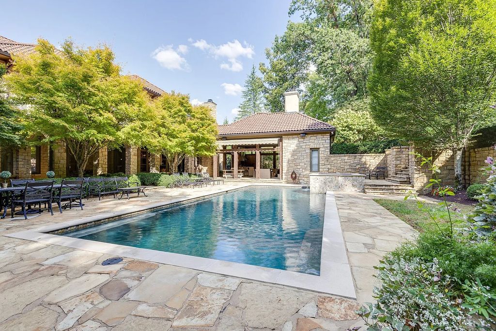 The Estate in Franklin is a luxurious home featuring private gated entry, mature trees, established landscaping, and beautiful views now available for sale. This home located at 1037 Vaughn Crest Dr, Franklin, Tennessee; offering 08 bedrooms and 12 bathrooms with 14,063 square feet of living spaces.